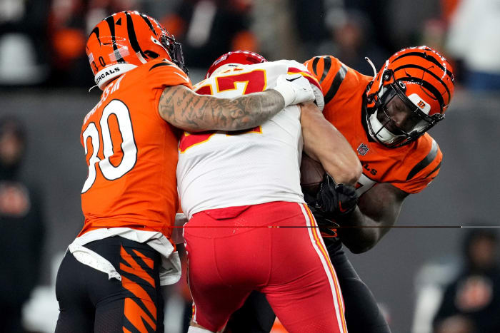 Dec 4, 2022; Cincinnati, Ohio, USA; Cincinnati Bengals linebacker Germaine Pratt (57) strips the ball from Kansas City Chiefs tight end Travis Kelce (87) for a turnover in the fourth quarter of a Week 13 NFL game at Paycor Stadium. Mandatory Credit: Kareem Elgazzar-USA TODAY Sports